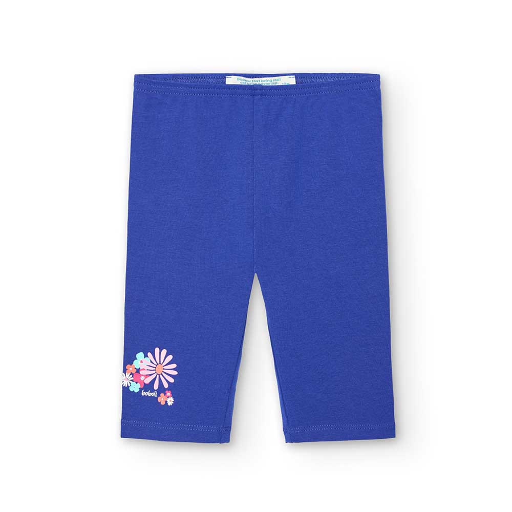 Calf-length leggings from the Boboli Girls' Clothing Line, in a solid color with a small flower p...