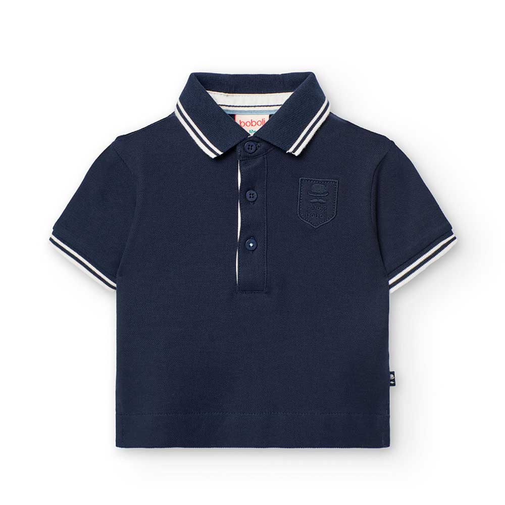 Solid color polo shirt from the Boboli Children's Clothing Line, with contrasting color details o...