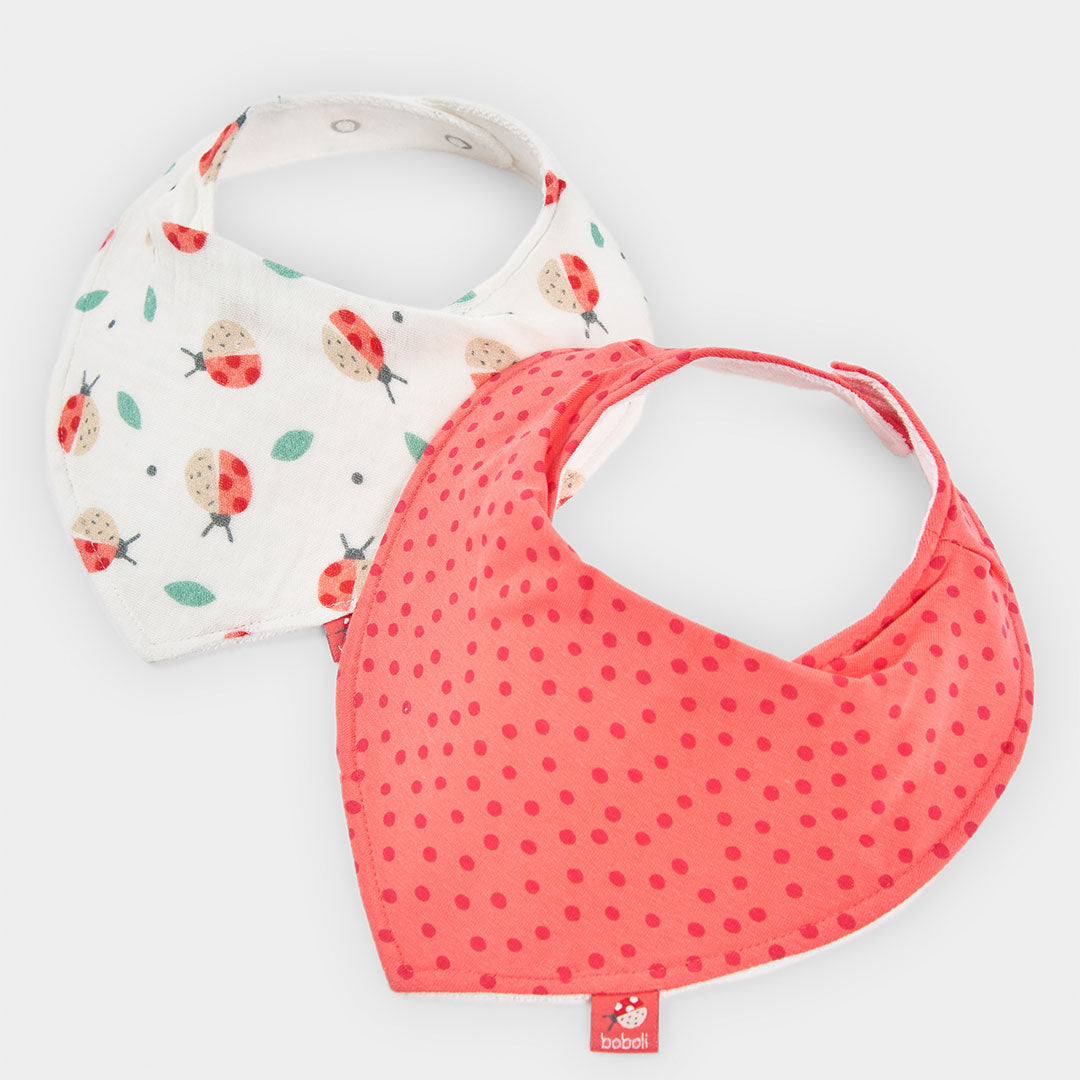Set consisting of two bibs from the Boboli Girls' Clothing Line, one white and the other in a sol...