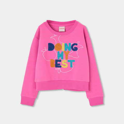 Felpa corta rosa con scritta multicolore per bambina.
