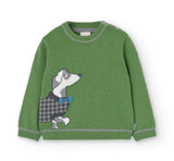 Maglione verde con ricamo di un cane bassotto davanti.