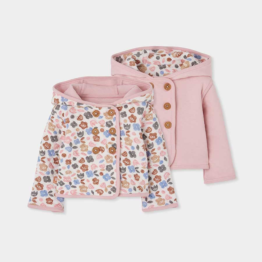 Avvolgi la tua piccola in questa giacchetta reversibile che unisce praticità e stile con dolcezza...