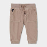 Pantaloni in velluto color beige con tasche e coulisse in vita per bambino