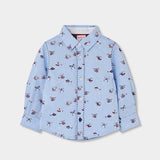 Camicia azzurra con stampa di piccoli elicotteri rossi e blu, collo classico e bottoni bianchi