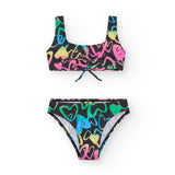 Costume da bagno per bambina con design colorato e accattivante.
