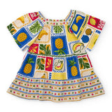Abito estivo multicolor per bambina con fantasia fruttata e design festivo.
