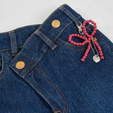 JEANS A ZAMPA CON CIONDOLO