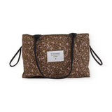 Borsa a spalla imbottita marrone con fantasia animalier e manici neri