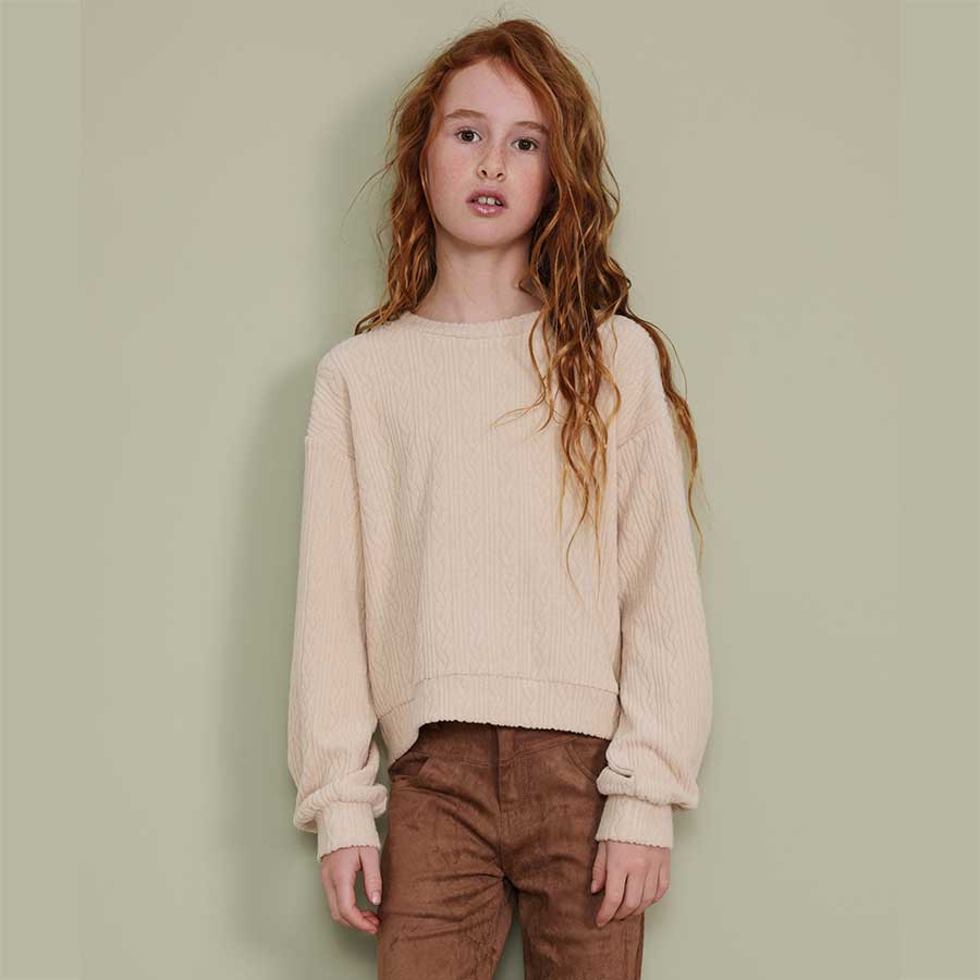 La maglia a treccia di Nath Kids è perfetta per l'autunno e l'inverno: calda, morbida e dal desig...