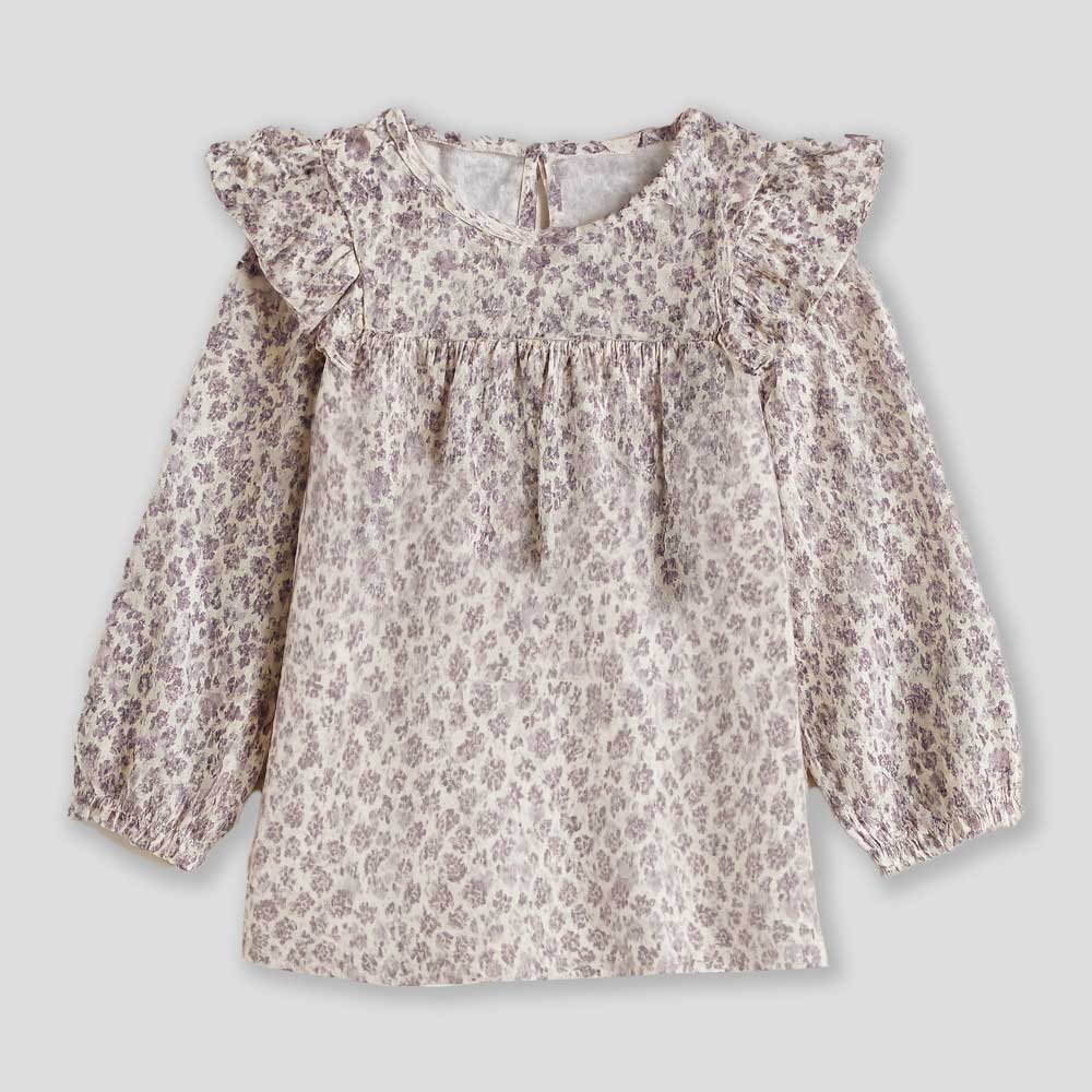 Regala un tocco di dolcezza e stile al guardaroba della tua bambina con questa camicia a fiori da...