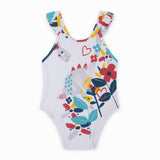 Costume da bagno bianco con stampa di dinosauri e voillant sulle bretelline.