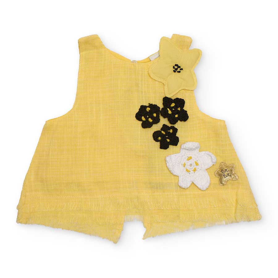 Top of the Line Girls' Clothing Tuc Tuc, with crochet and fabric applications. Fringed at the bot...