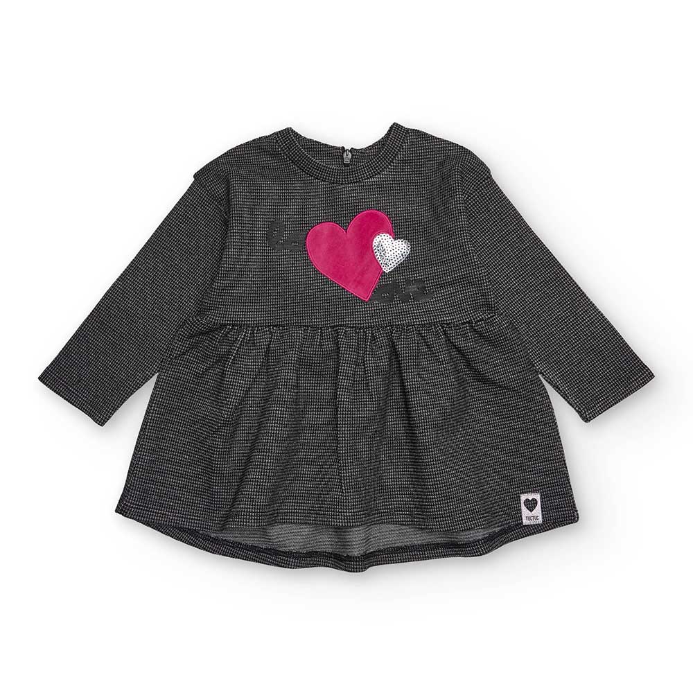 Dress from the Tuc Tuc Girls' Clothing Line, with fabric featuring metallic thread and a small he...