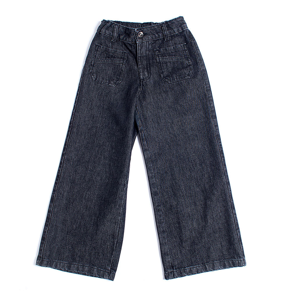 
  Denim trousers from the Fracomina Mini girl's clothing line, with model a
  palace and large p...