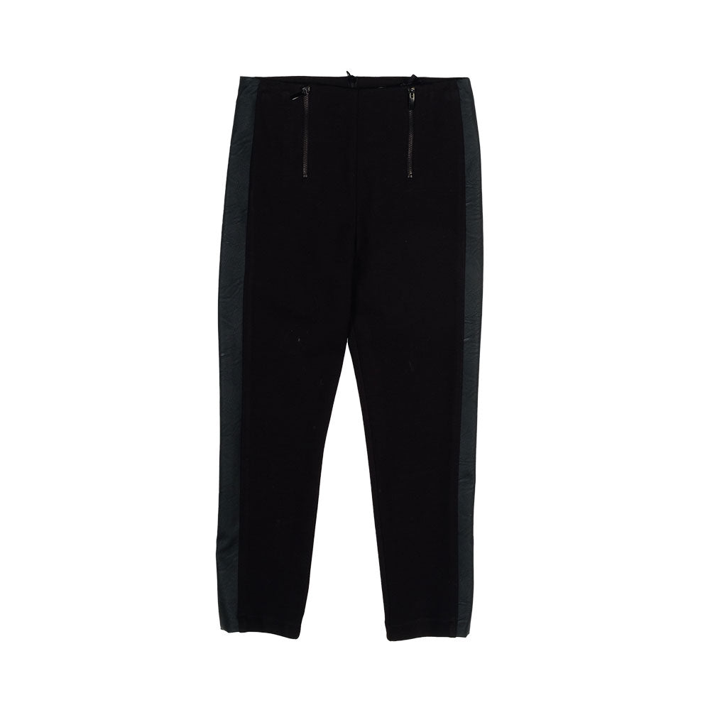 
Trousers from the Fracomina Girls' Clothing Line, in technical fabric, with faux leather inserts...