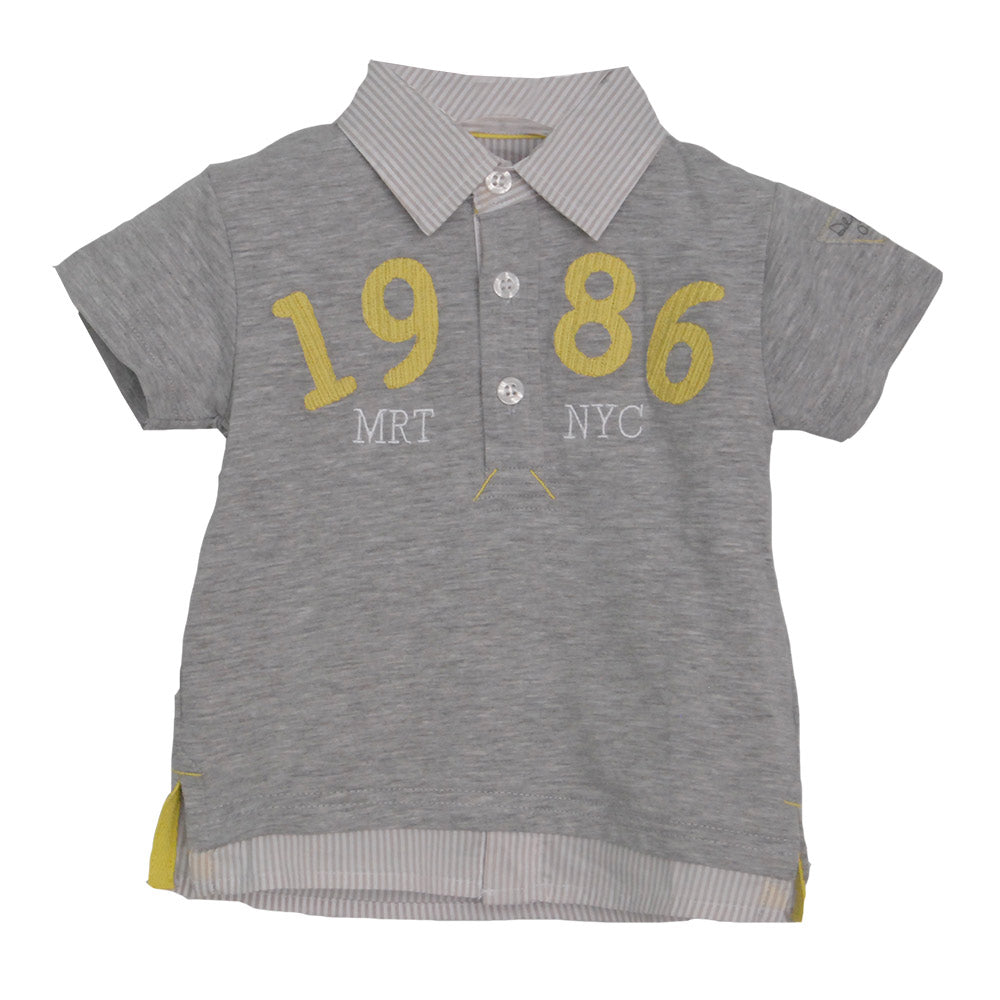 
  Polo shirt from the children's clothing line Mirtillo. Solid colour with embroidery on the fro...