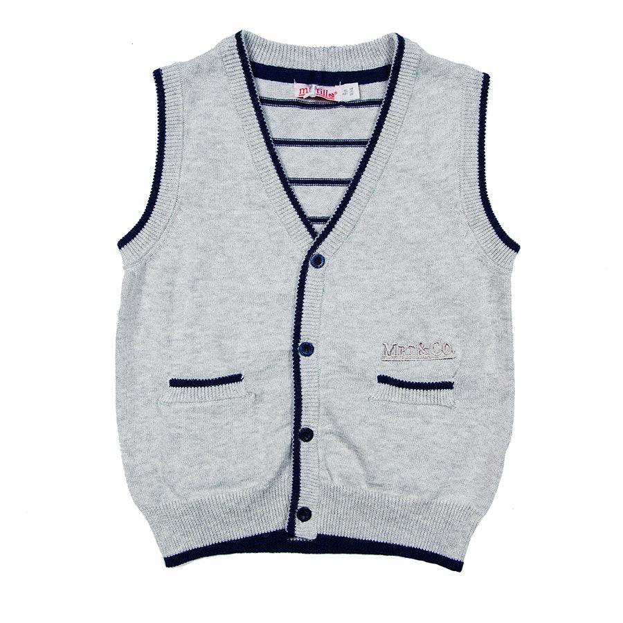 
  V-neck vest from the children's clothing line Mirtillo with open v-neck at the front
  with bu...