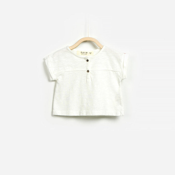 T-shirt from the Play Up girls' clothing line in flamed cotton, with buttons on the front.
Compos...