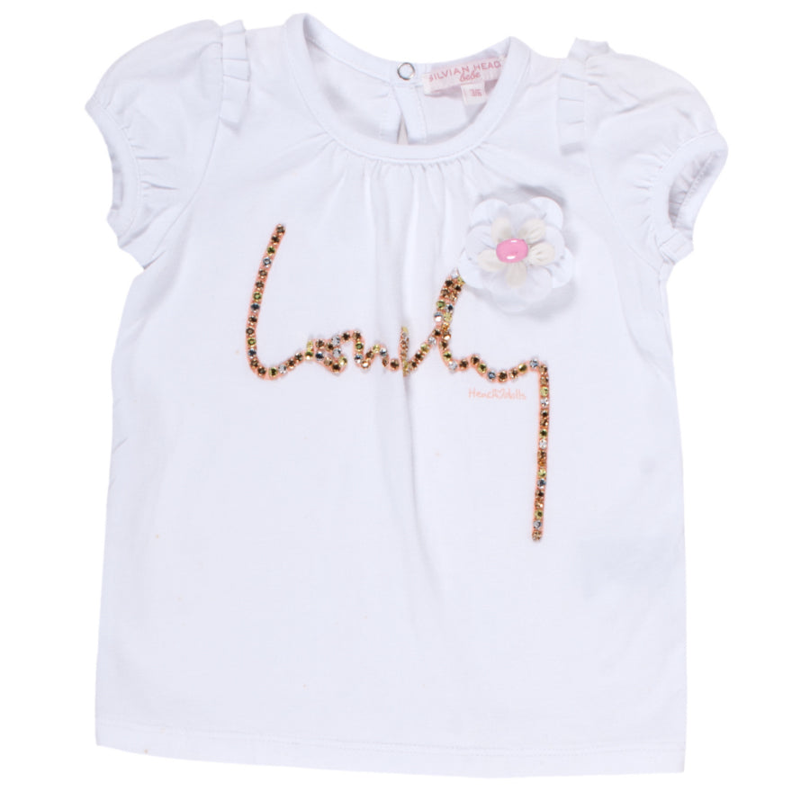 
  T-shirt from the Silvian Heach Kids clothing line; with mannequin
  balloon short, solid color...