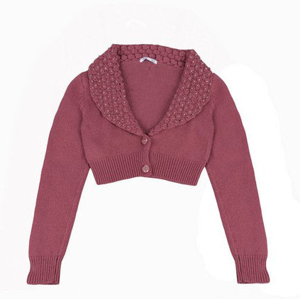 
  Short knitted cardigan from the Silvian Heach girl's clothing line, elegant model closed on th...