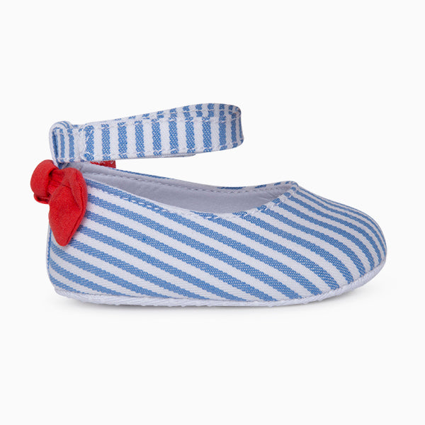 
  Fabric shoes from the Tuc Tuc children's clothing line, with striped pattern
  and fabric bow ...