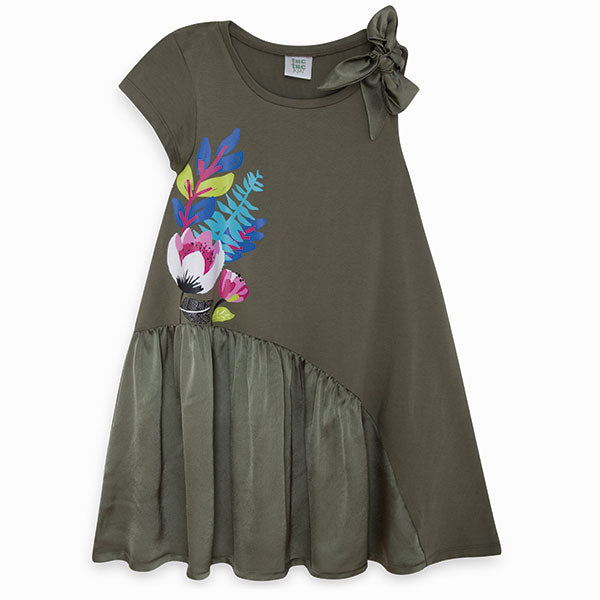 
  Dress from the Tuc Tuc girl's clothing line, with a single sleeve and a bow
  on the other sho...