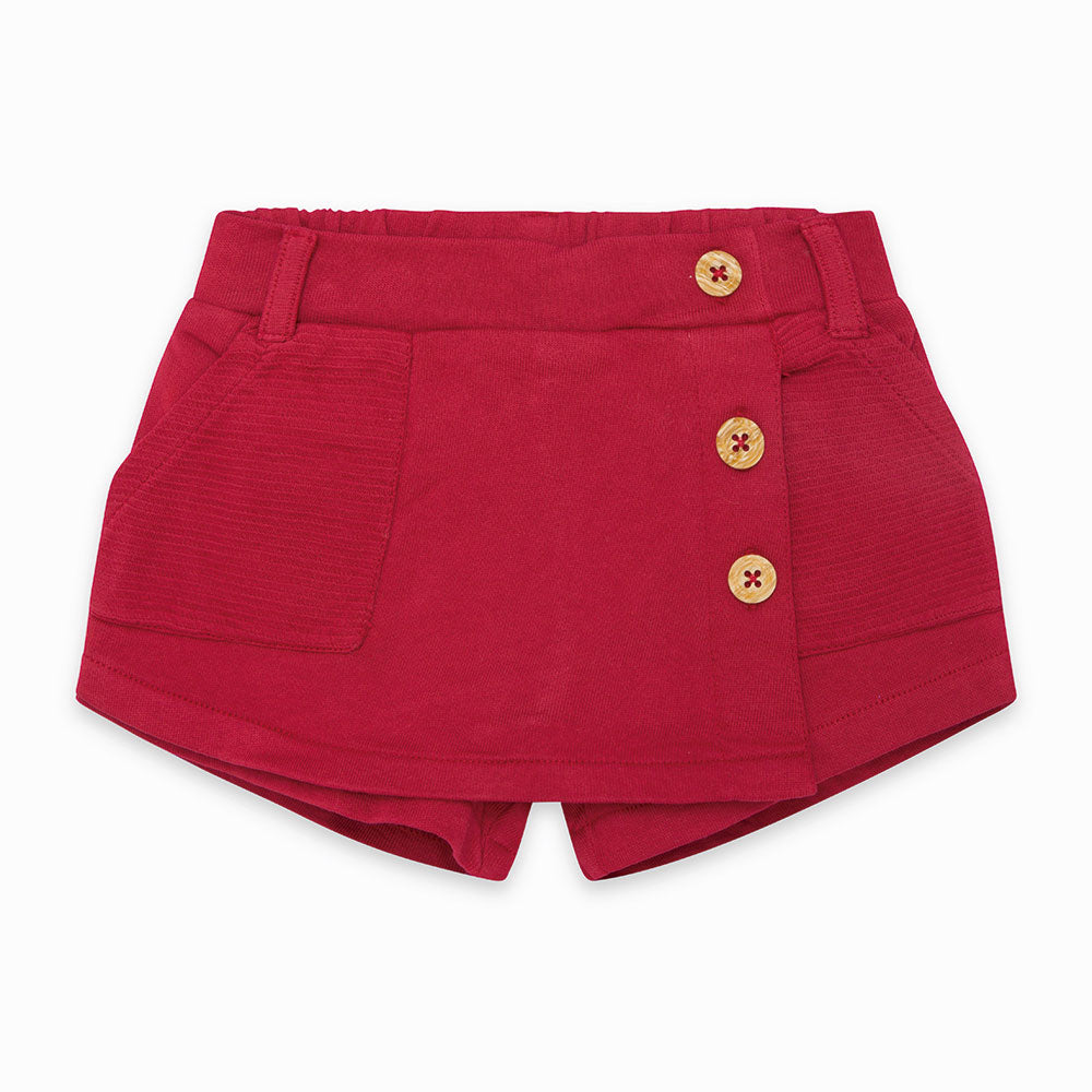 
  Faux skirt shorts from the Tuc Tuc Girls Clothing Line in solid color
  and with buttons on on...