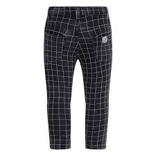 Trousers from the Tuc Tuc children's clothing line, with patches on the knees and checked pattern...