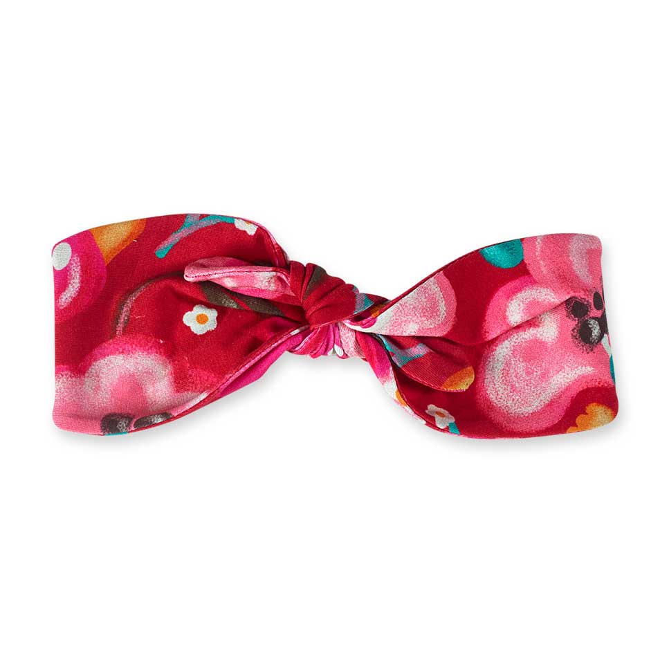 Hair band from the Tuc Tuc Girls Clothing Line, with a floral pattern in bright colors.
Compositi...